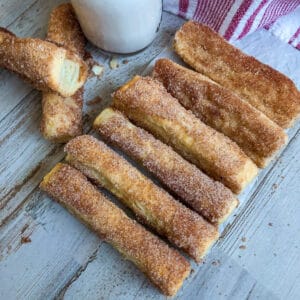 easy baked churros with a glass of milk for serving