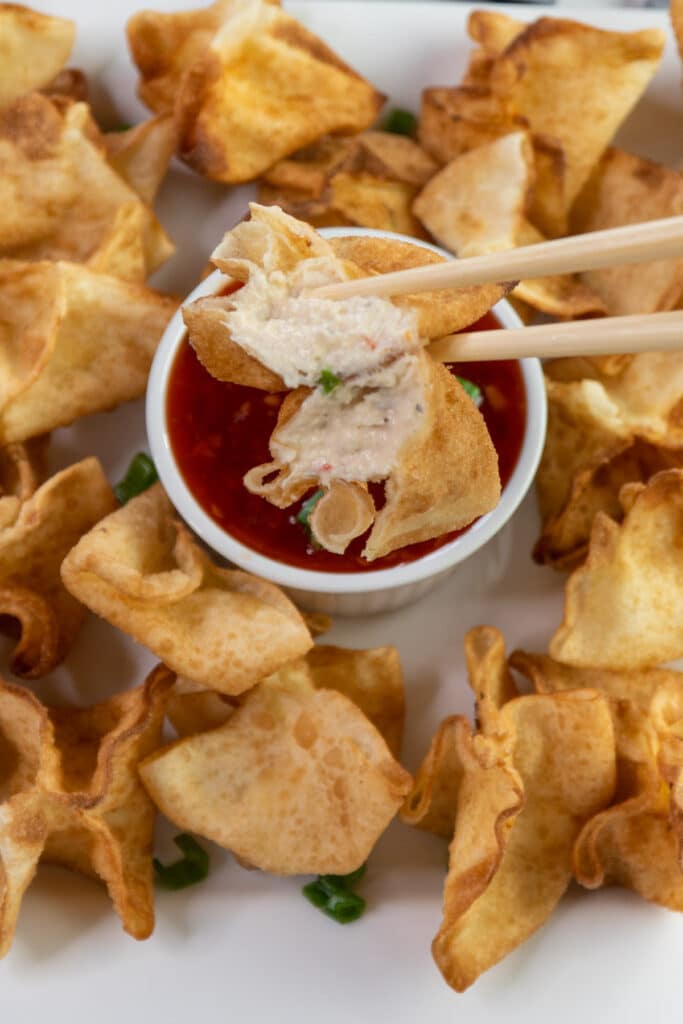Close up of a crab Rangoon to show off the cream cheese filling.