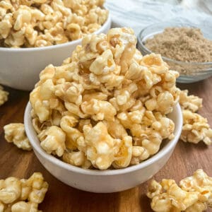 The most amazing caramel popcorn served in a white bowl