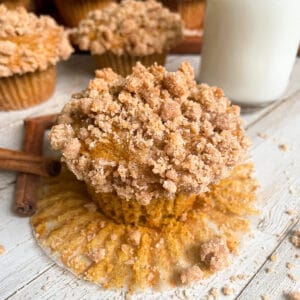 The Most Amazing Pumpkin Muffins With Crumb Topping served with a glass of milk