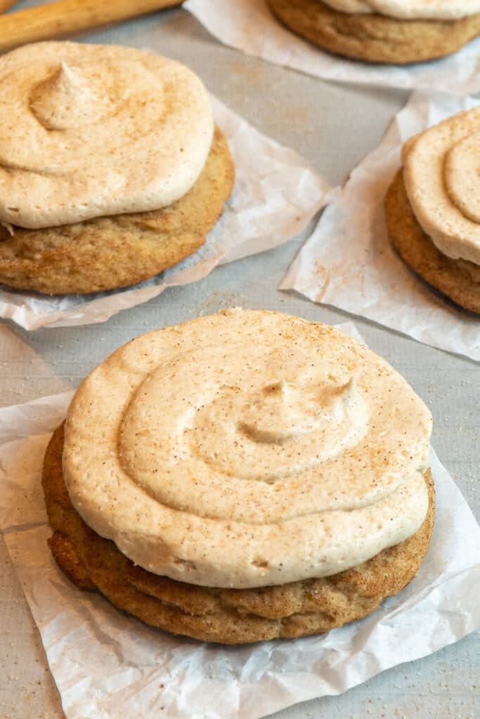 Close up of copycat Crumble churro cookies on a piece of parchment paper.