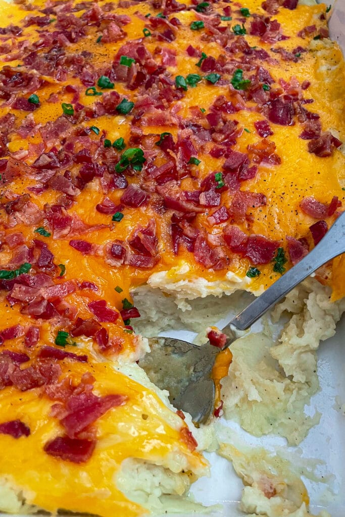 loaded mashed potato casserole recipe topped with bacon and cheddar cheese