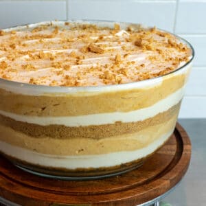Pumpkin trifle in a glass trifle bowl.