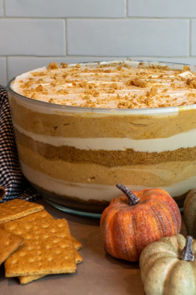 Close up of a pumpkin trifle in a glass trifle dish.