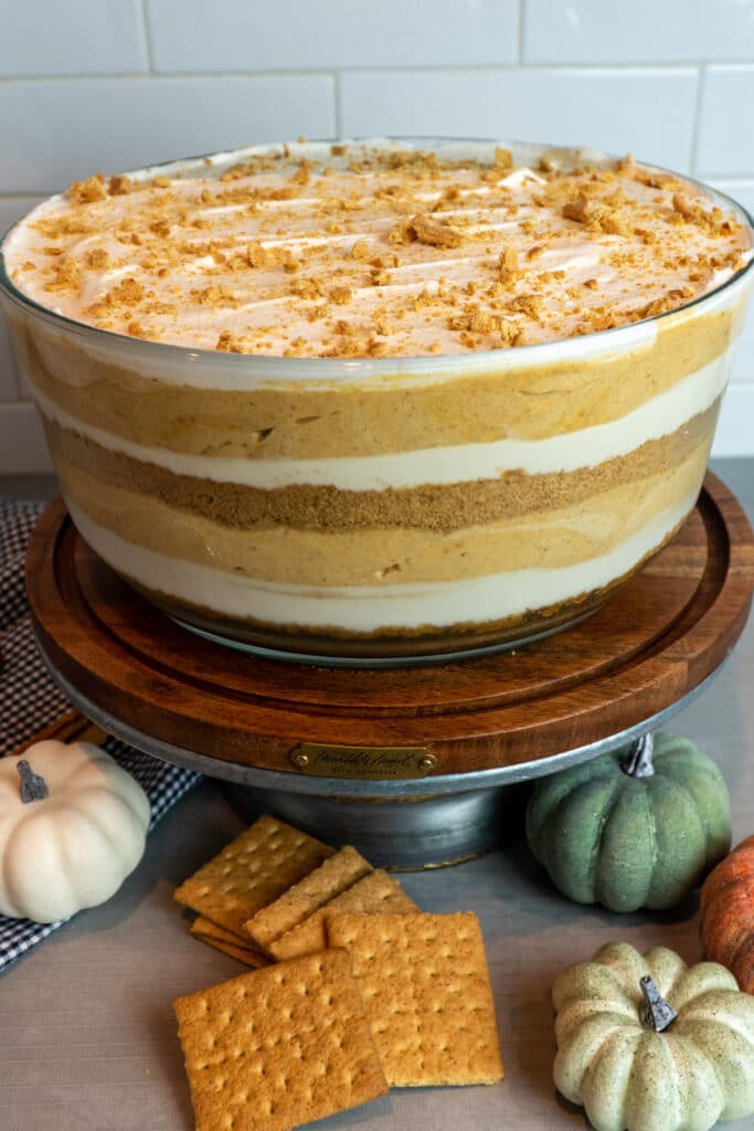 Close up of a pumpkin trifle in a glass trifle dish.