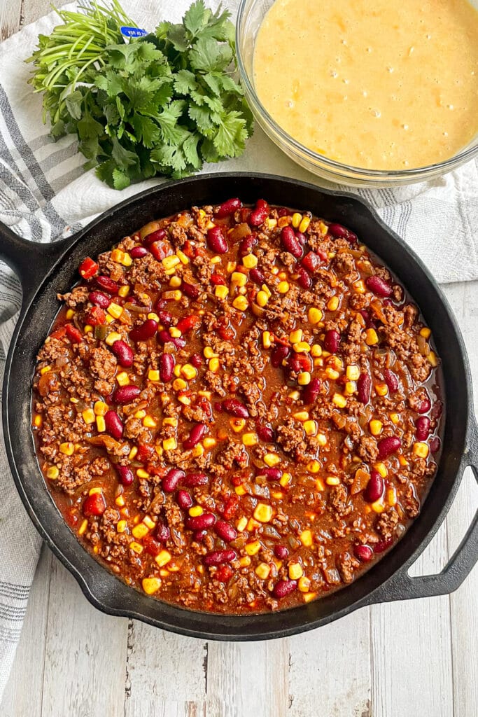 cornbread chili pie in the skillet