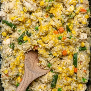 Close up of crock pot chicken and rice in a slow cooker.