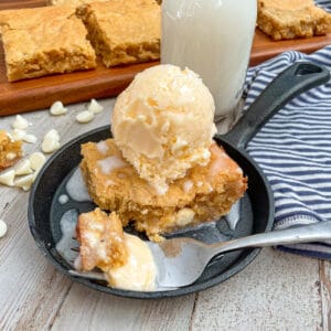 the best white chocolate chop blondie recipe served with cold ice cream and vanilla sauce