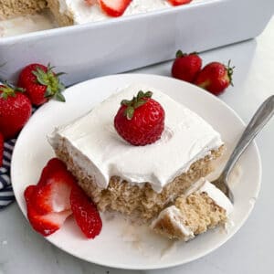 close up photo of Tres Leches cake topped with strawberries
