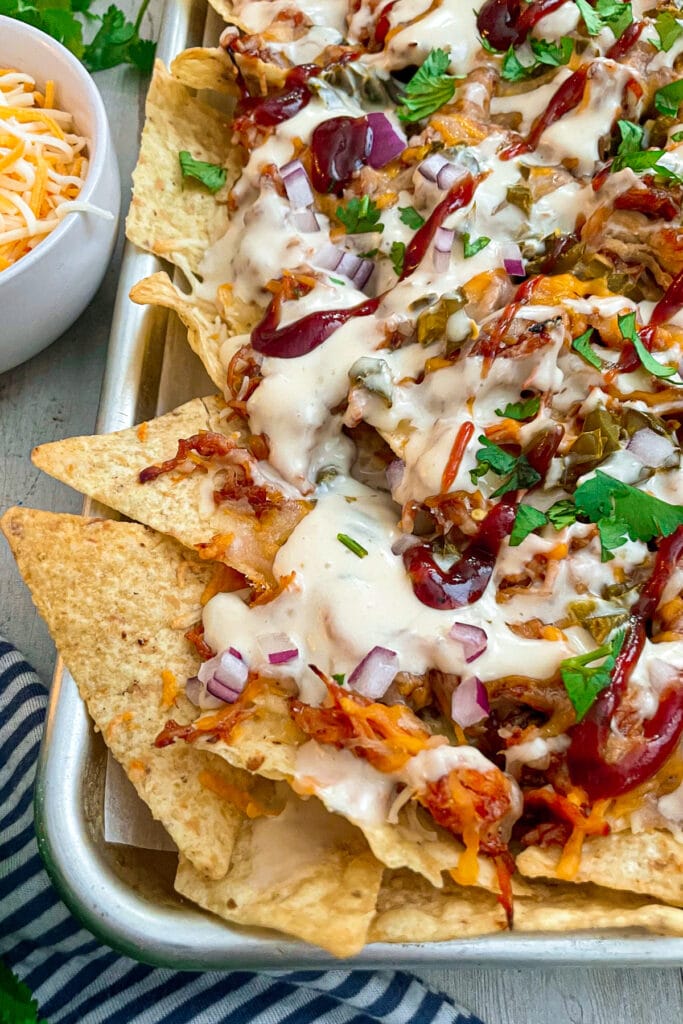 close up shot of sheet pan BBQ chicken nachos