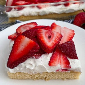 close up shot of a slice of strawberry shortcake dessert bars