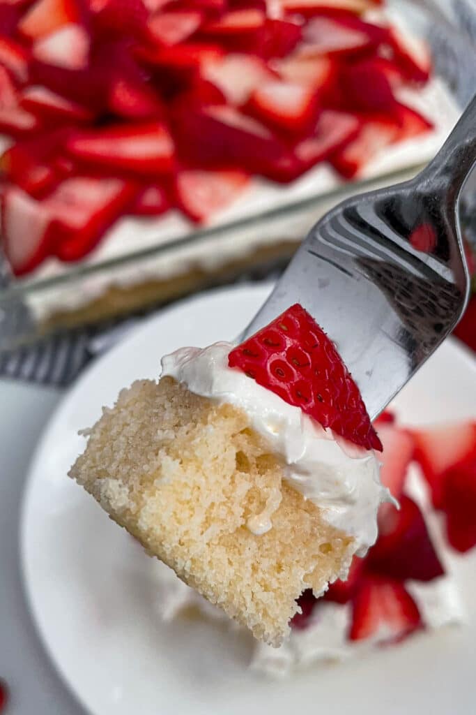 close up shot of a bite of strawberry shortcake