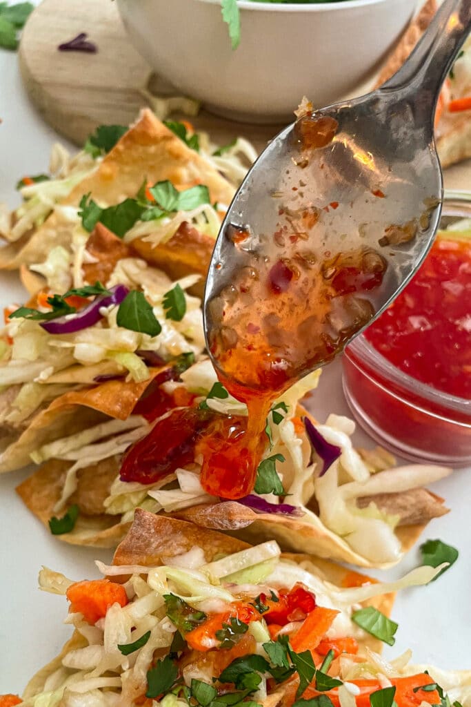 baked wonton tacos drizzled with sweet chili sauce