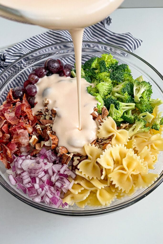 ingredients for broccoli grape pasta salad in a large serving bowl