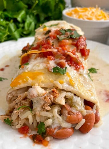 close up photo of smothered honey lime chicken burrito