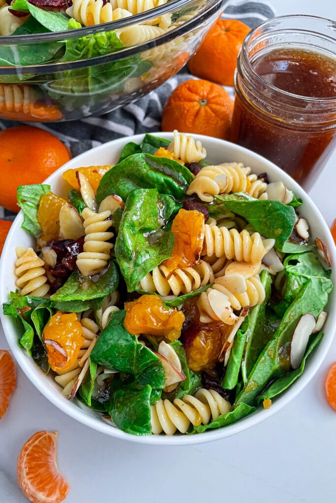 close up shot of mandarin spinach pasta salad