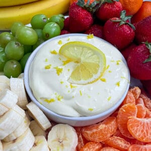 close up shot of lemon cream fruit dip with fresh fruit