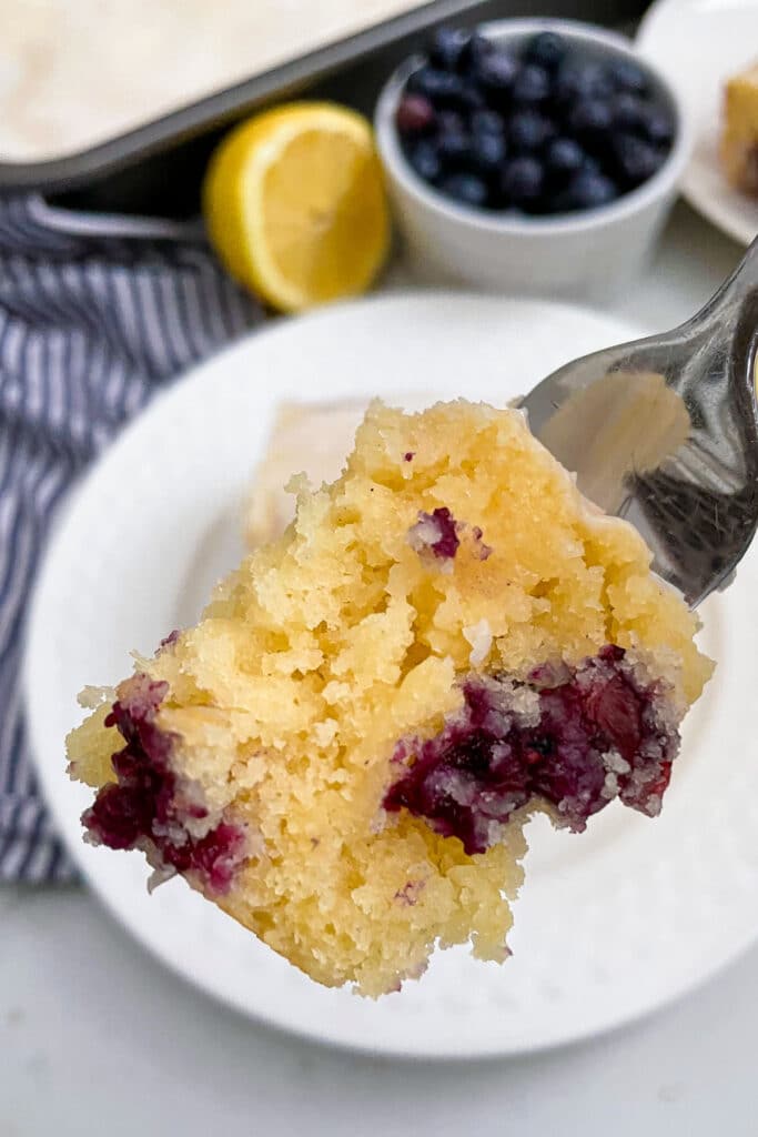 close up shot of a bite of lemon blueberry cake