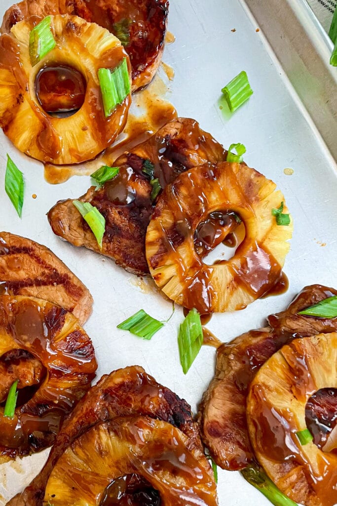 easy grilled pork chops on a sheet pan with grilled pineapple