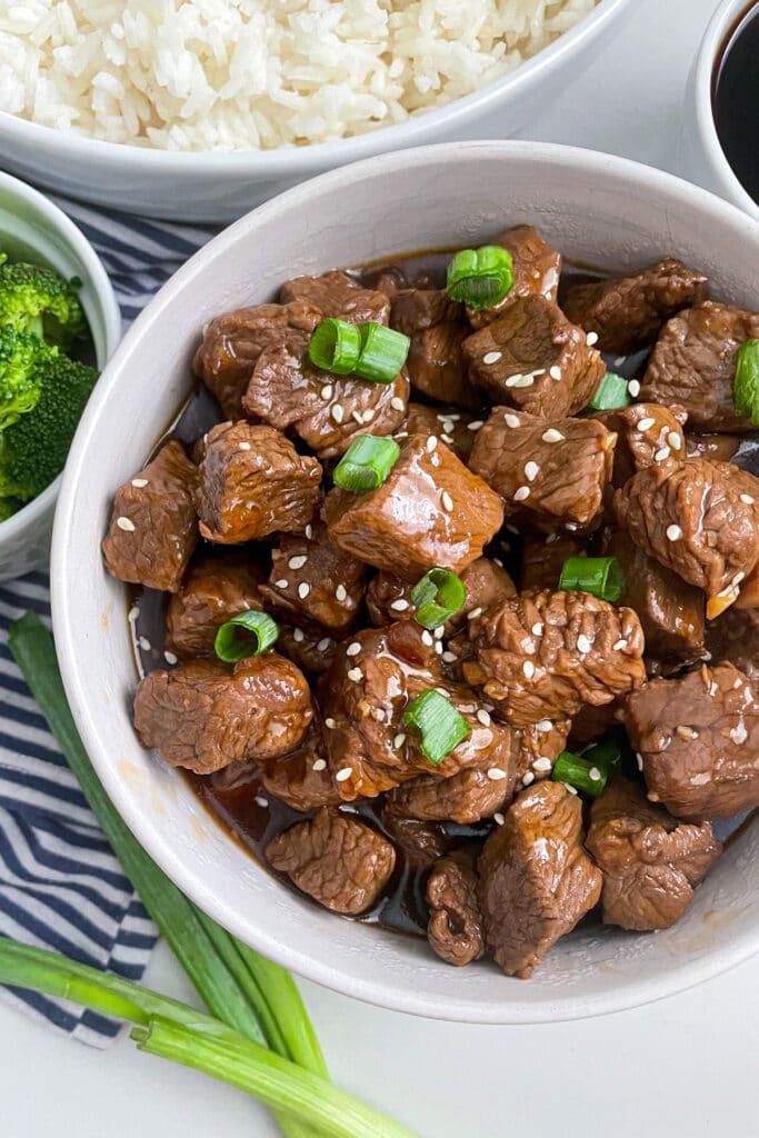 teriyaki steak bites in a white serving bowl