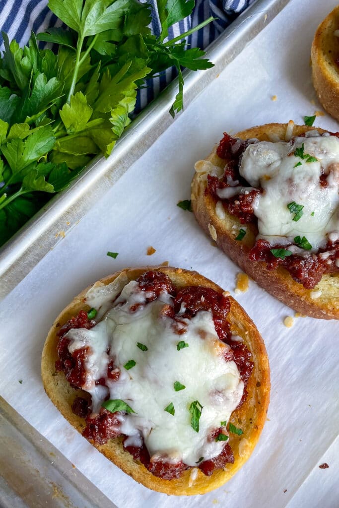 close up shot of Texas toast sloppy joes with fresh parsley on the side