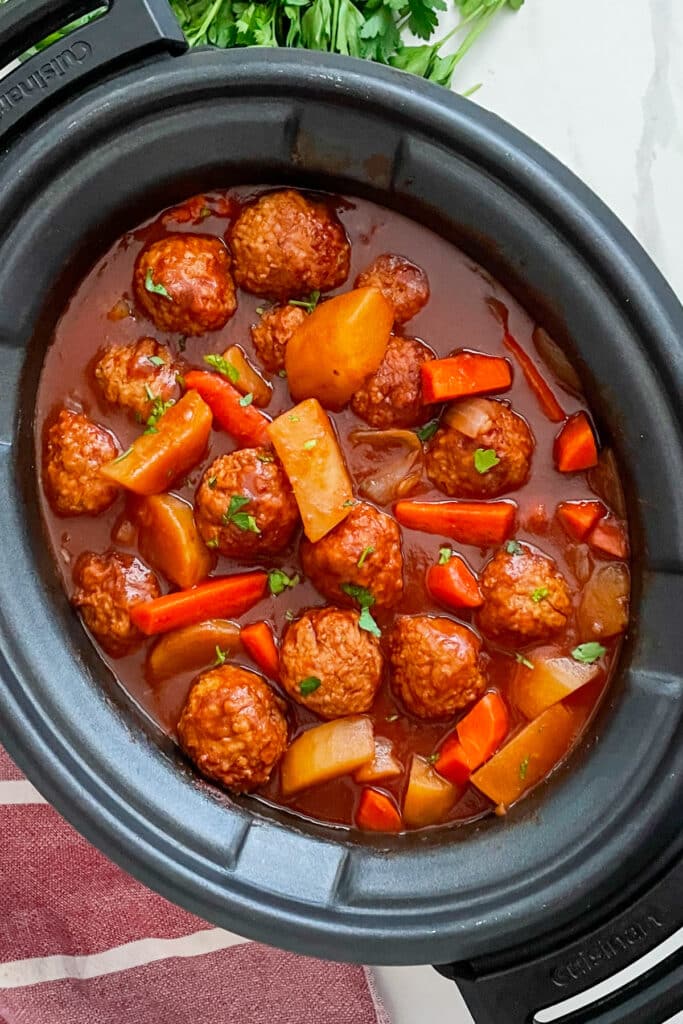 Slow Cooker Meatball Pot Roast in a crock pot for serving