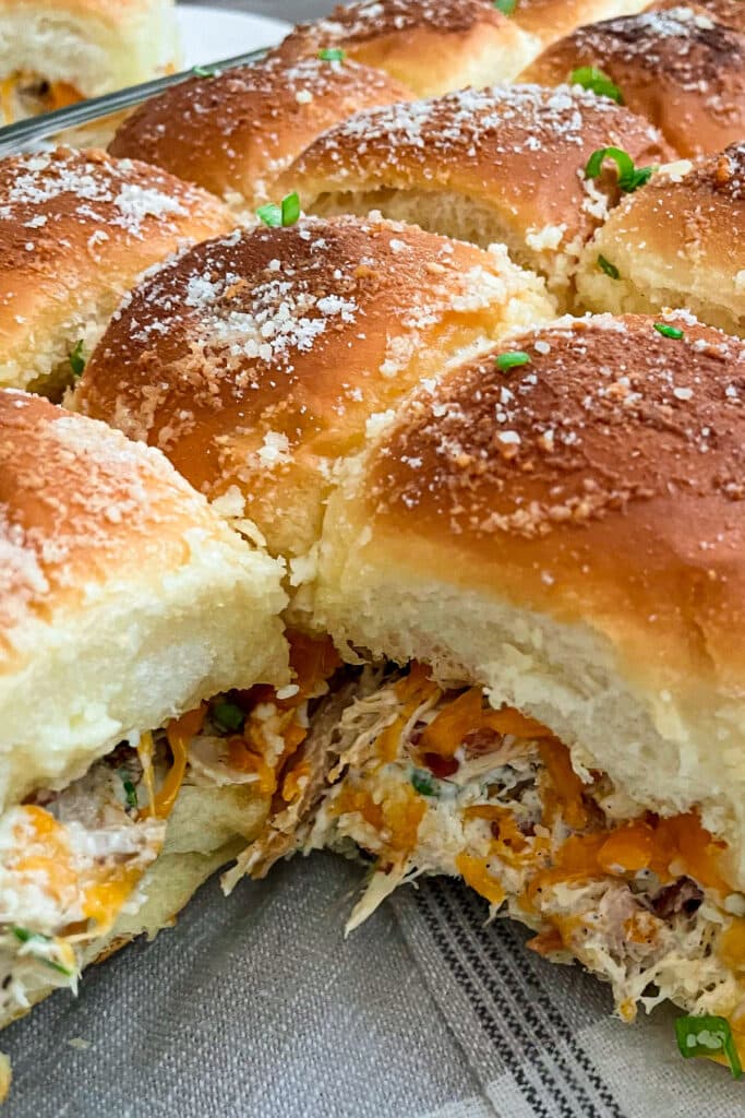 close up photo of crack chicken sliders in a baking dish