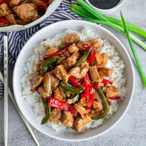 One Pot Black Pepper Chicken served in a white dish with white rice.