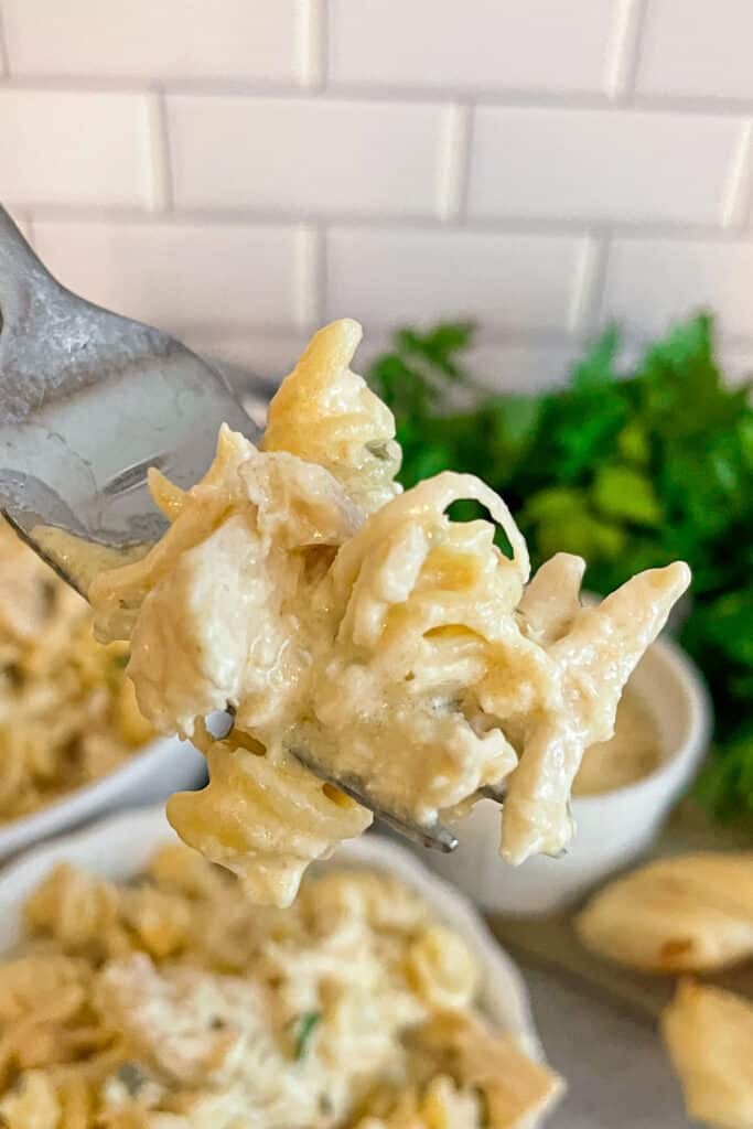 close up shot of garlic parmesan chicken on a serving fork
