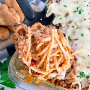 close up shot of spaghetti out of the oven and a spoonful for serving