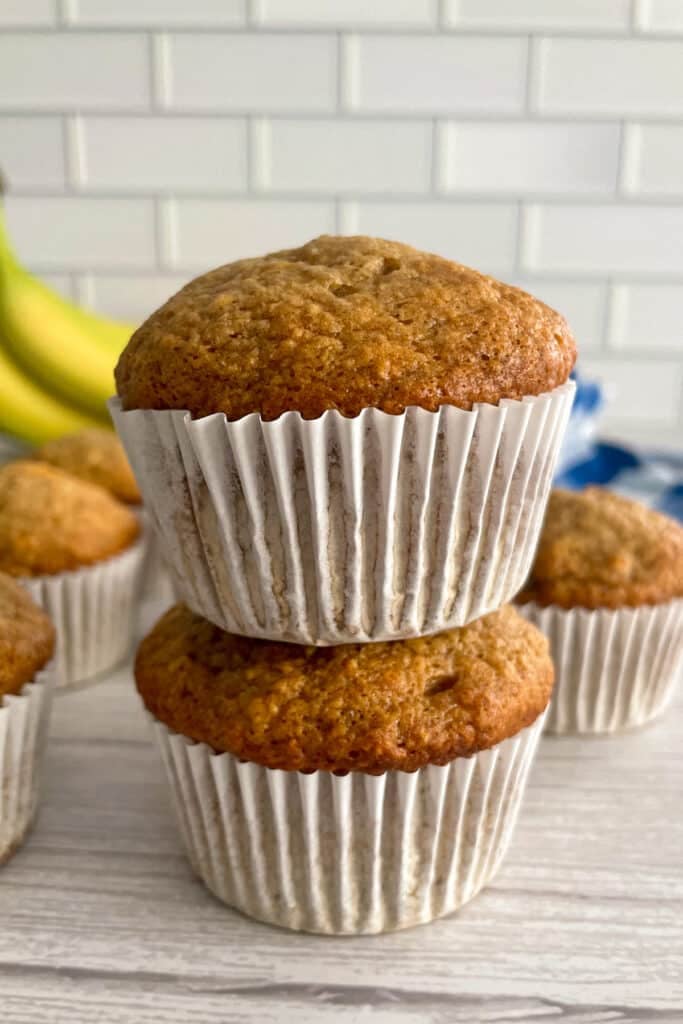 Easy banana muffins stacked on top of each other.