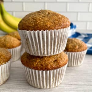 Easy banana muffins stacked on top of each other.
