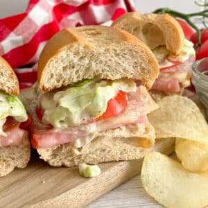 Copycat Grinders Italian sandwich cut in half for serving.