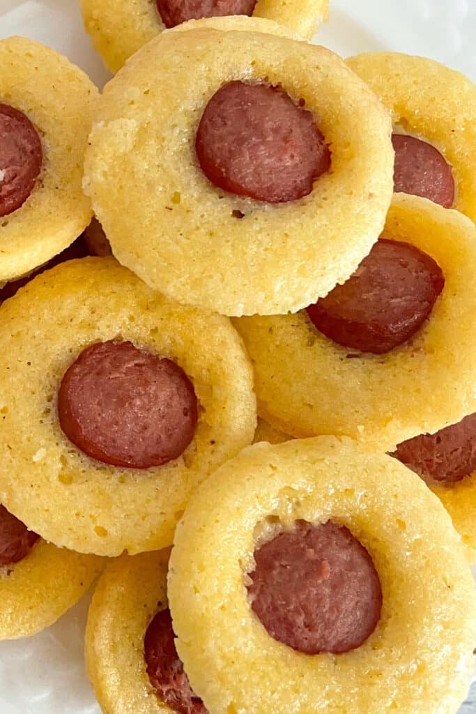 mini corn dog bites stacked on top of each other for serving