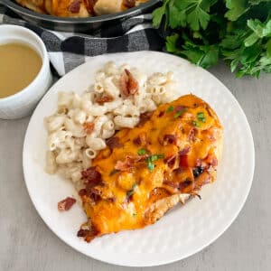 Outback Alice Springs Chicken on a serving plate with mac n cheese on the side