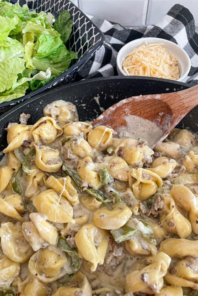 close up shot of one pan Philly cheesesteak tortellini in skillet ready for serving