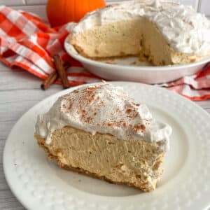 slice of Easy No-Bake pumpkin cream pie recipe on a white serving plate for eating
