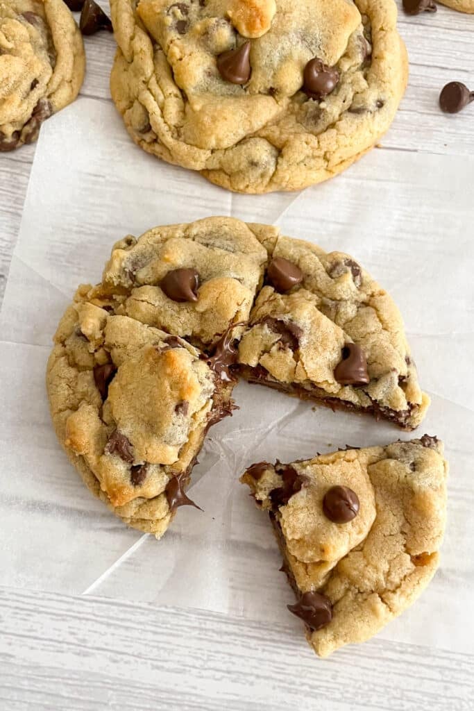One large Crumbl cookie cut into four individual pieces