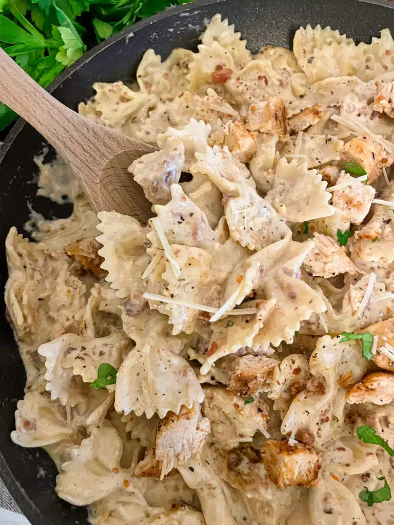 close up shot of one pot pasta dinner with chicken and bacon in a creamy ranch sauce.