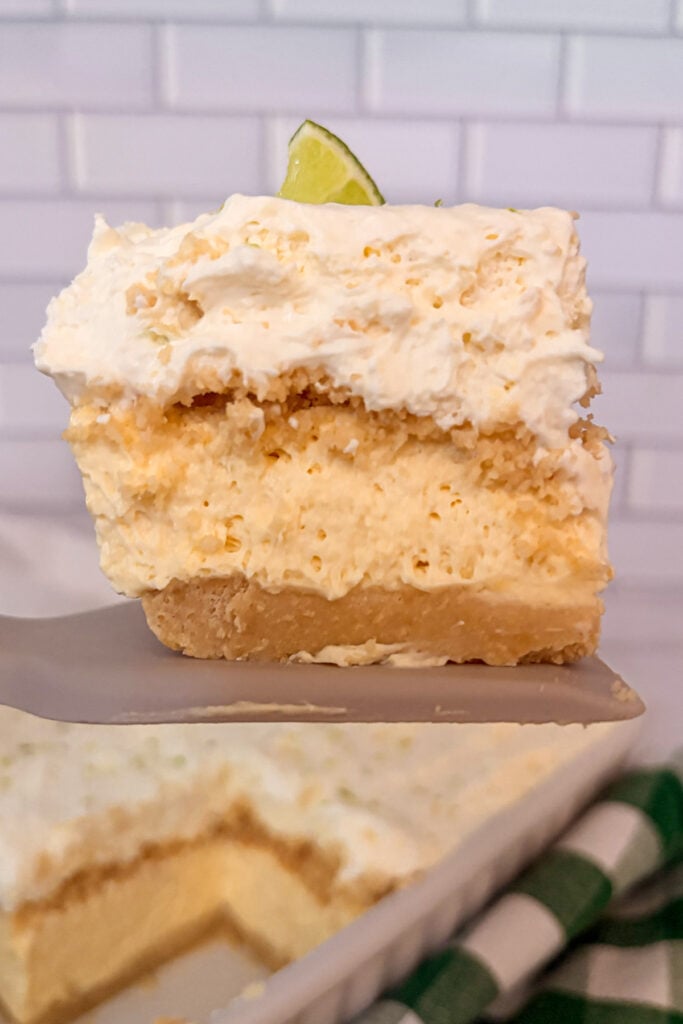 close up shot of key lime pie lush on a spatuala to show the layers of the dessert