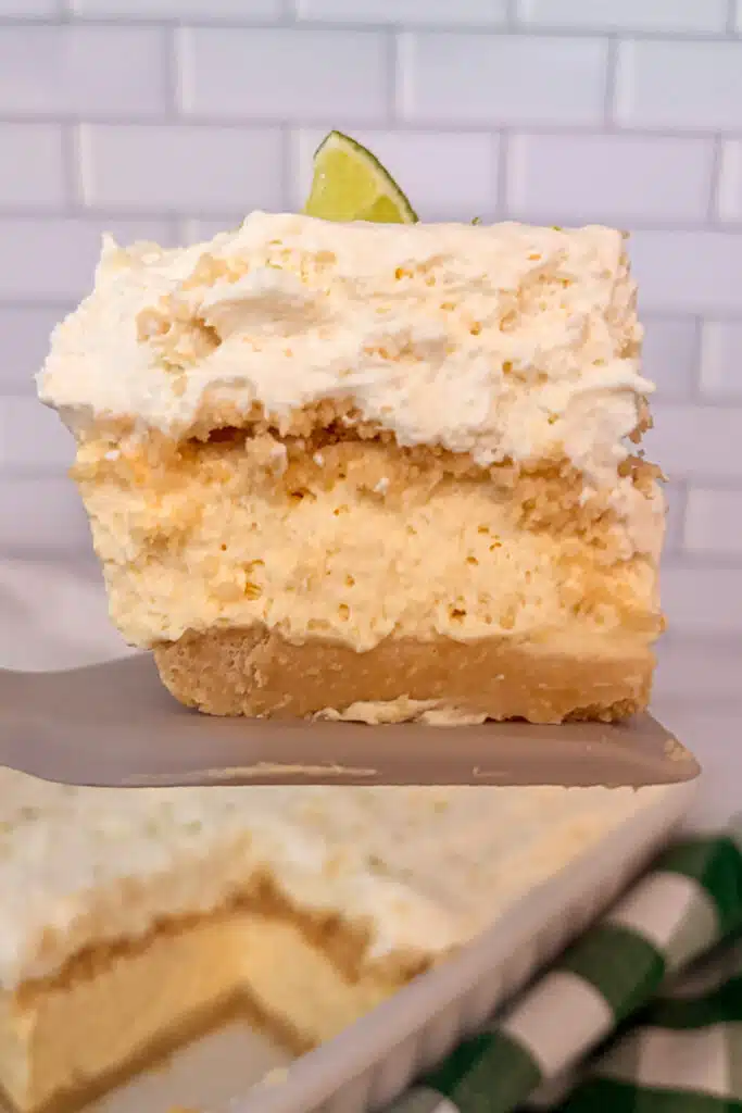 close up shot of key lime pie lush on a spatuala to show the layers of the dessert